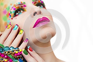 Colorful makeup and manicure .