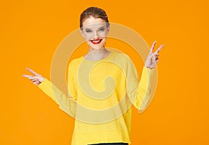 Colorful makeup woman red lips in yellow clothes on color happy summer fashion background manicured nails