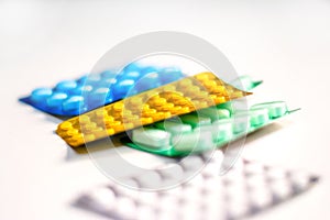 Colorful Many pills and tablets isolated on white background, pharmaceuticals antibiotic drug capsule pills in package.