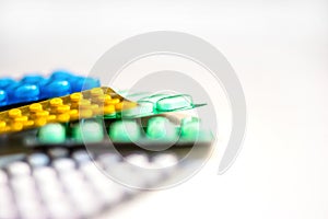 Colorful Many pills and tablets isolated on white background, pharmaceuticals antibiotic drug capsule pills in package.