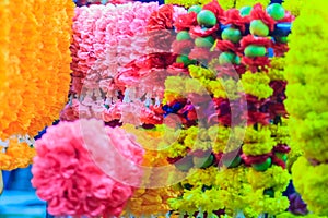 Colorful marigold flower garlands for hindu religious ceremony.