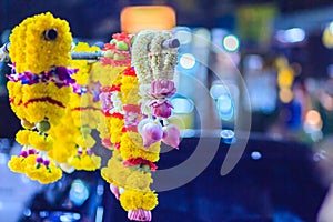Colorful marigold flower garlands for hindu religious ceremony.