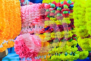 Colorful marigold flower garlands for hindu religious ceremony.