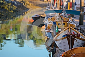 Colorful marina filled with wooden boats