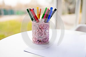 Colorful marker pens in holder