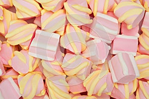 Colorful marshmallow candies for background use, top view