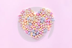 Colorful marshmallow in heart shape.Party and celebration.decorative background texture