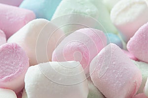 Colorful marshmallows background close up. Fluffy cute marshmallows