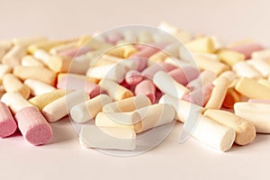 Colorful marshmallows on a light background. Close-up. Selective focus