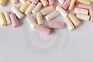 Colorful marshmallows on a light background. Close-up. Selective focus