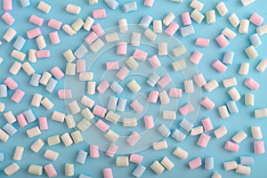 Colorful marshmallows pattern on blue background