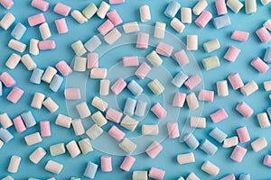 Colorful marshmallows pattern on blue background