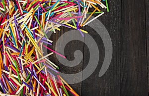 Colorful match sticks on dark office table top with copy space banner