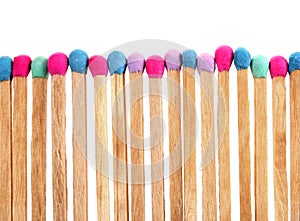 Colorful matches perfectly sharpened placed in level row