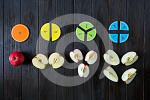 Colorful math fractions on brown wooden background or table. interesting math for kids. Education, back to school concept.