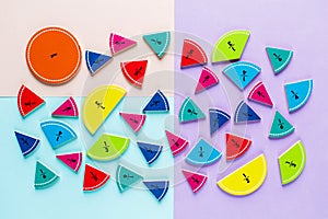 Colorful math fractions on the pink blue violet bright backgrounds. Interesting math for kids. Education, back to school concept.