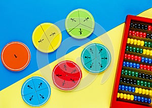 Colorful math fractions on the yellow and blue bright backgrounds. interesting math for kids. Education, back to school concept