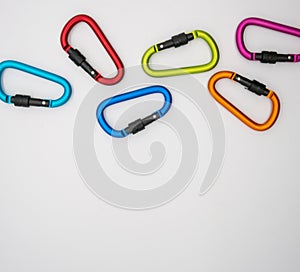 Colorful matte metal aluminum snap hook isolated on white background.