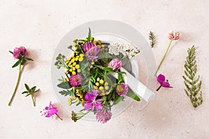 colorful medical flowers and herbs in mortar