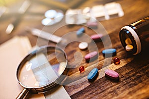 Colorful medical tablets and pills on doctor's office desk