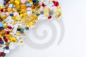 Colorful medication and pills from above on white background with copy space