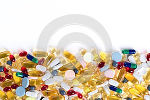 Colorful medication and pills from above on white background