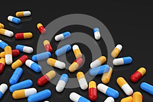 Colorful medicine capsules on dark background, horizontal