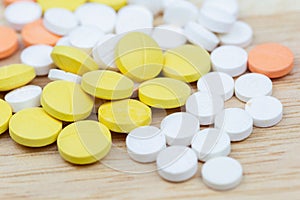 Colorful medicine pills tablets or drugs closeup.