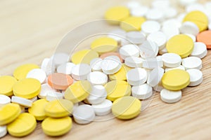 Colorful medicine pills tablets or drugs closeup.