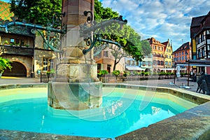 Colorful medieval half-timbered facades with Schwendi fountain, Colmar, France