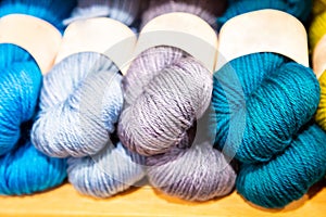 Colorful melange yarn balls on a shelf in a retail store