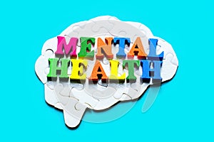 Colorful Mental Health Lettering and Human Brain Puzzle