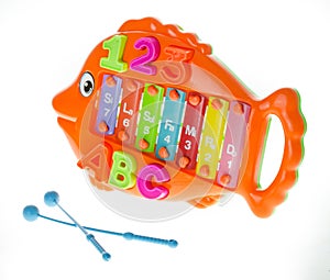 Colorful metallophone or xylophone in form of fish- musical and developing toy. Development of fine motor skills of