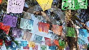 Colorful mexican perforated papel picado banner, festival colourful paper garland. Multi colored hispanic folk carved tissue flags