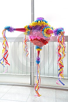 A colorful Mexican piñata ready for a party.