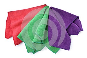 Colorful microfiber cloths on white background, top view