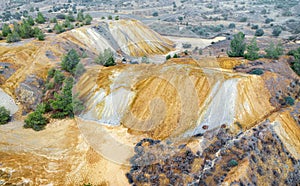 Colorful mine tailings and spoil heaps at abandoned copper mine