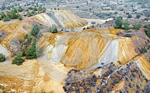 Colorful mine tailings and spoil heaps at abandoned copper mine photo