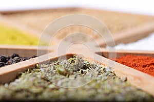 Colorful mix of spices in a wooden container. Food. Oriental spices