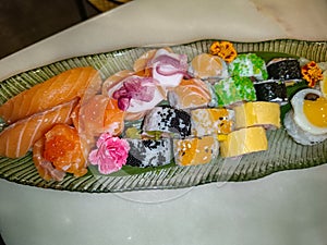 Colorful mix of sushi pieces of makis photo