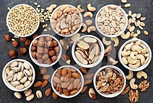 Colorful mix of various nuts; healthy diet snack; vegan food backgro