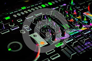 Colorful mixer section of DJ Controller with jog wheels and effects buttons