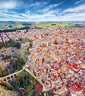 Colorful morning view from flying drone of Gravina in Puglia cityscape.