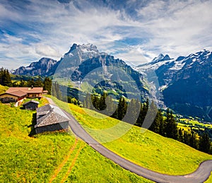 Colorful morning view of Grindelwald village valley from cableway. Wellhorn mountain, Bernese Oberland Alps. Switzerland, Europe.