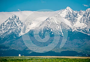 Colorful morning view in spring season with snow on peaks