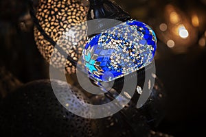 Colorful Moroccan lamp with blue glass mosaic design. Oriental style