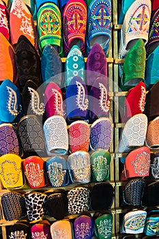 Colorful Moroccan oriental shoes aligned in a shop at medina of Fez, Morroco
