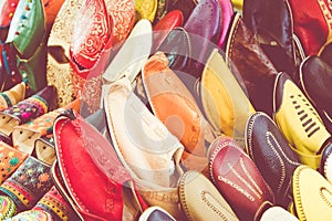 Colorful Moroccan shoes alignment in a shop. Oriental shoes in a