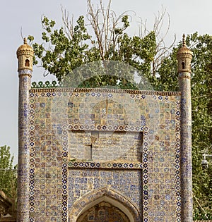 Colorful mosaic tiles on entrance to Tomb of the Fragrant Concubine, Kashgar, China photo