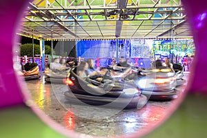 Colorful motion blur of bumper cars at carnival